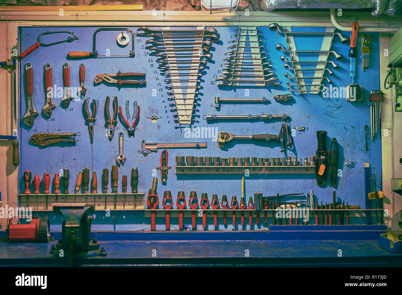 Blue board in ship's engine with plent different types of