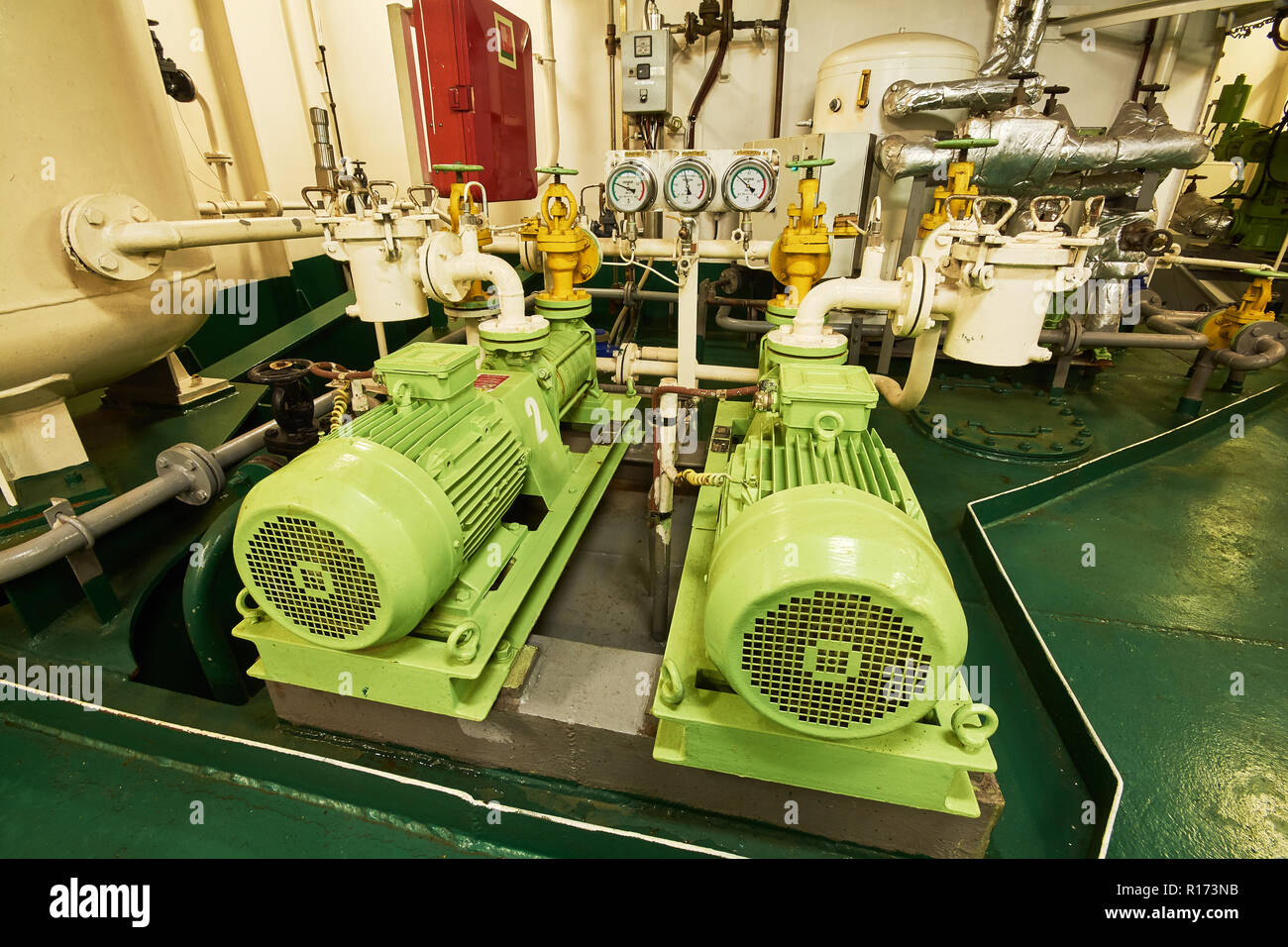 Panoramic view of electric motors on a merchant ship in the engine room