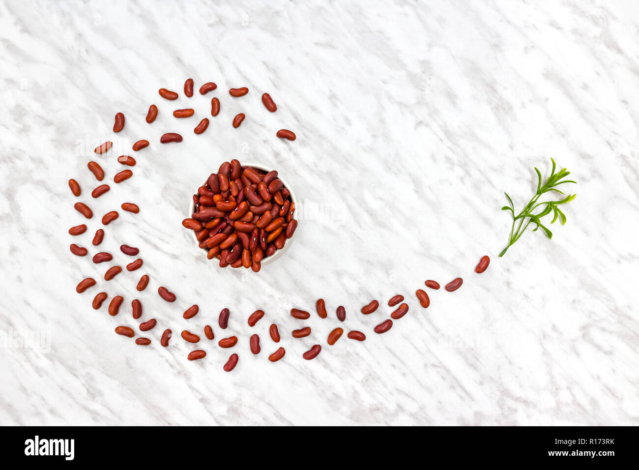 Styled red kidney beans on white marble background. Cooking ingredients. Stock Photo