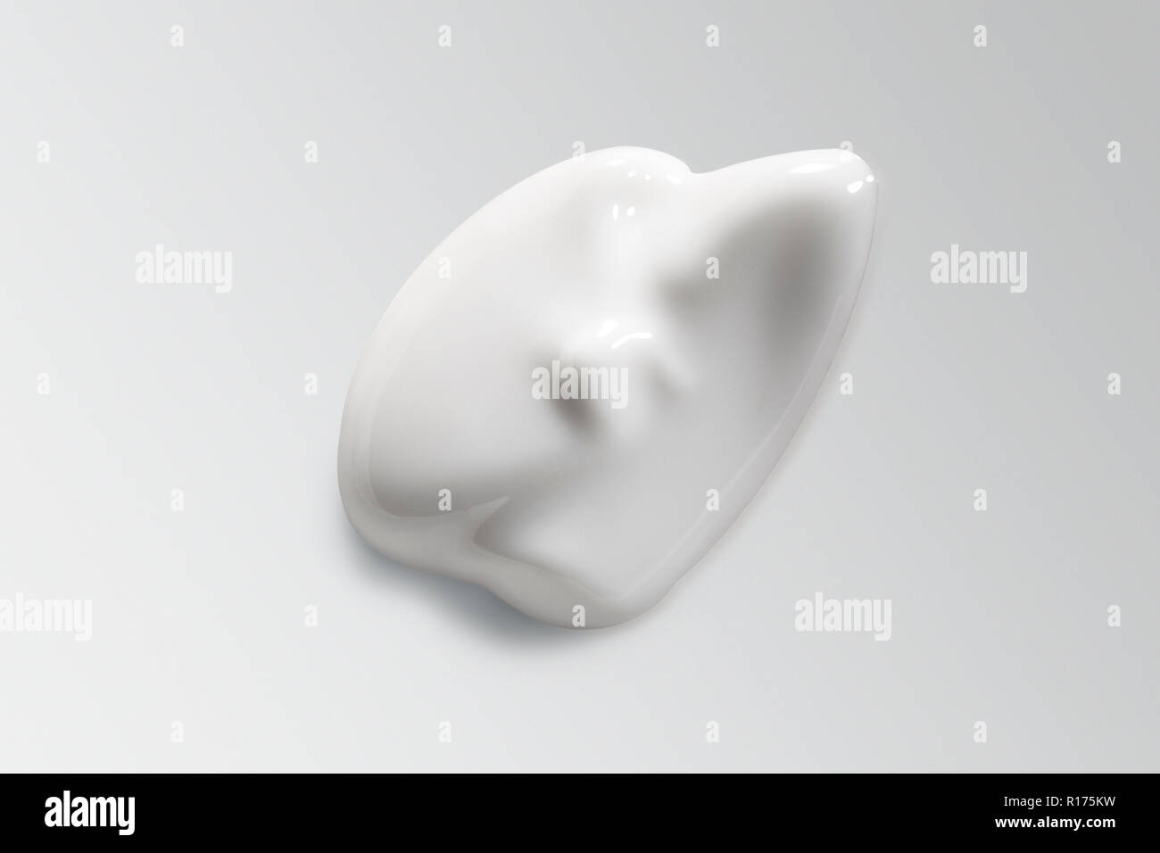 Irregular shaped mound of cosmetic cream on white background Stock Photo