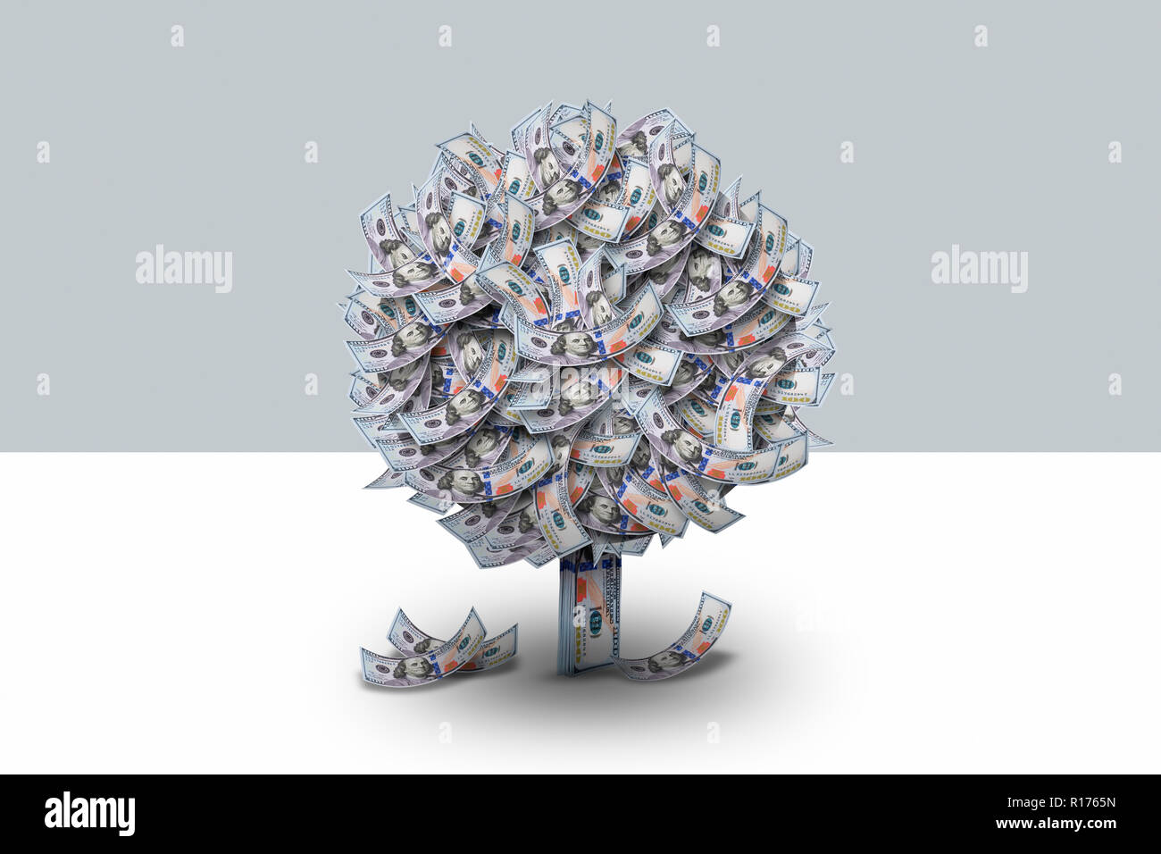 US dollars folded into shape of tree, grey background Stock Photo