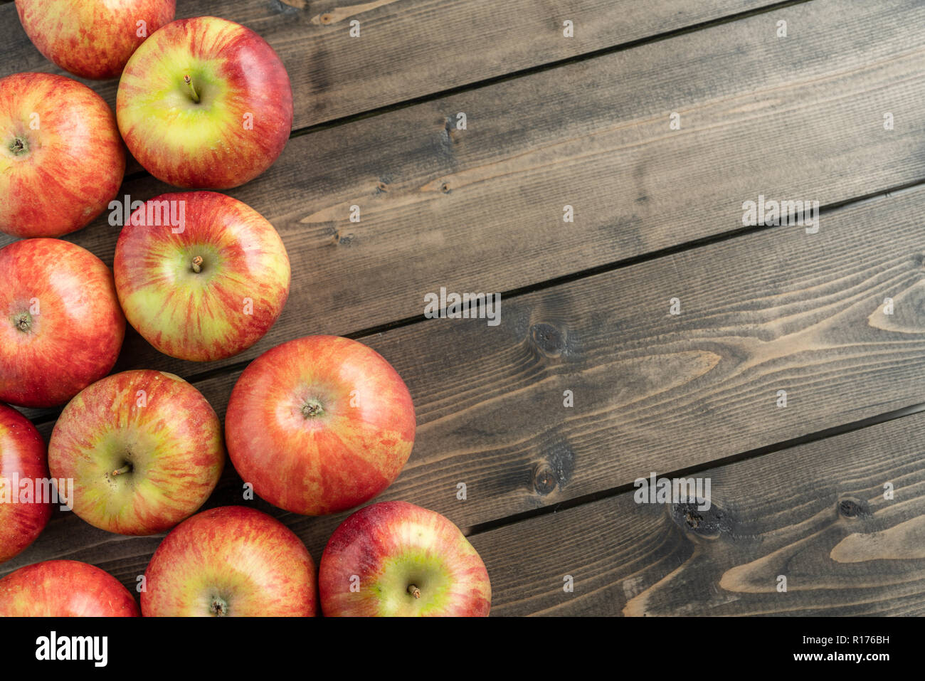 Red apples on wooden table Stock Photo - Alamy