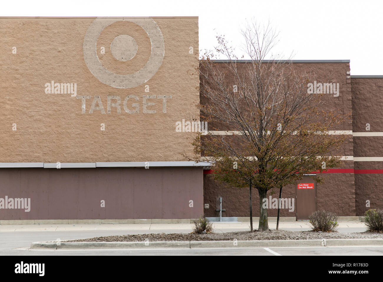 The faded outline of a logo sign outside of a closed Target Corporation