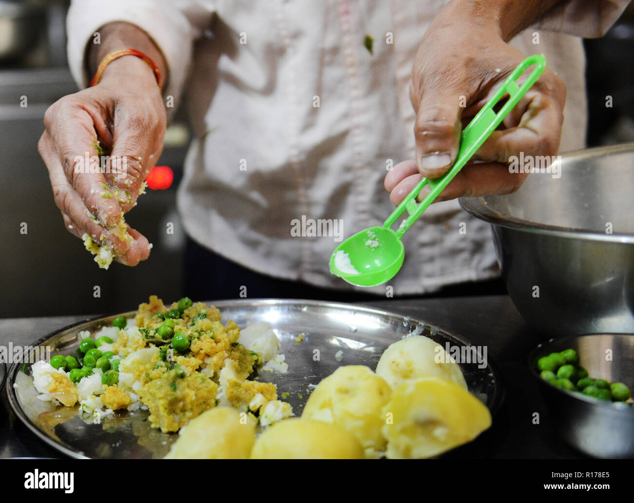 Preparing Millet cutlets in Kaulige restaurant on Brigade road in Bangalore. Stock Photo