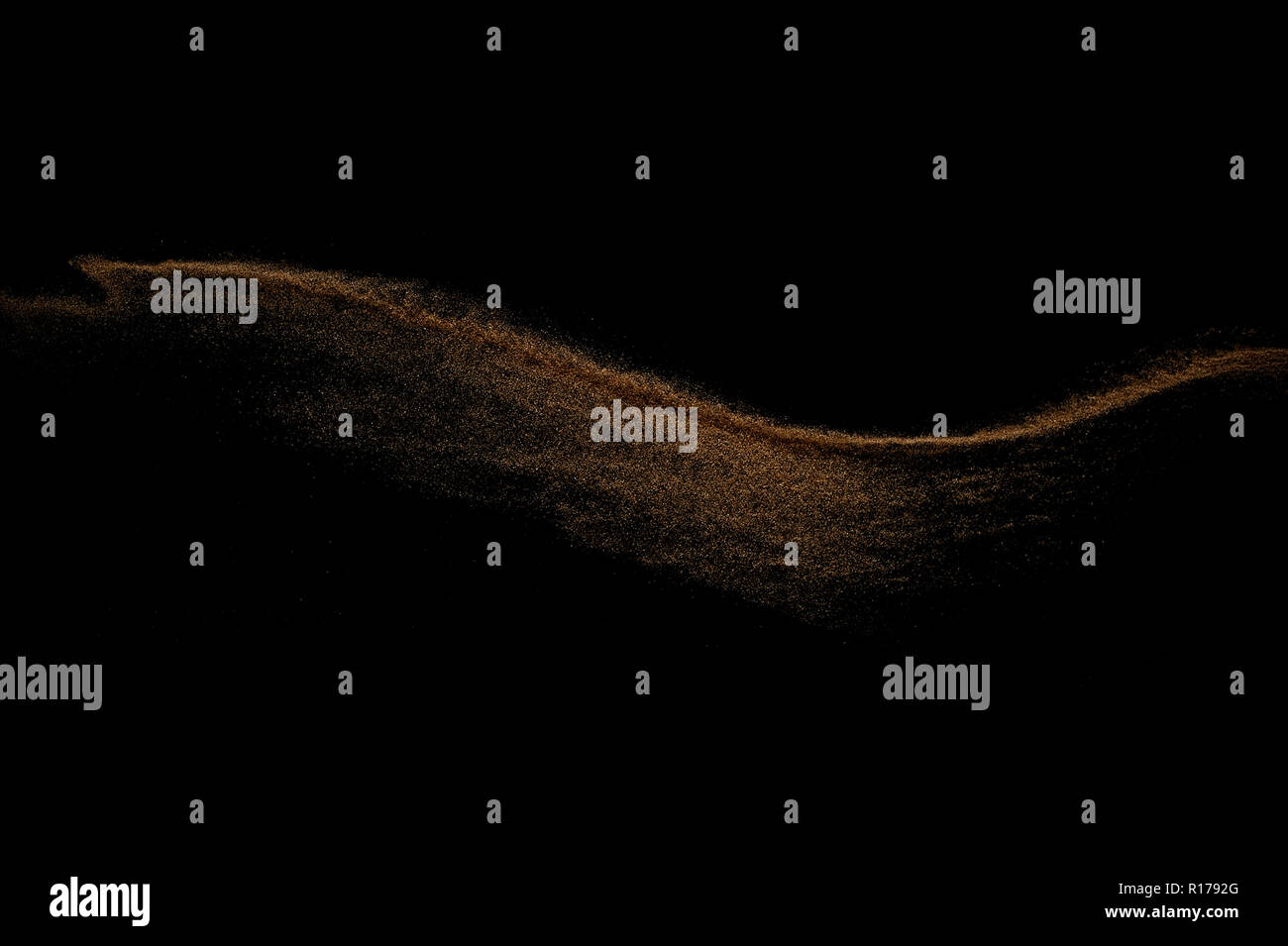 Sandy wave isolated on black background. Abstract sand dune. Stock Photo