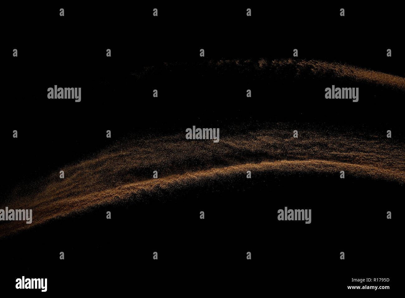 Sandy wave isolated on black background. Abstract sand dune. Stock Photo