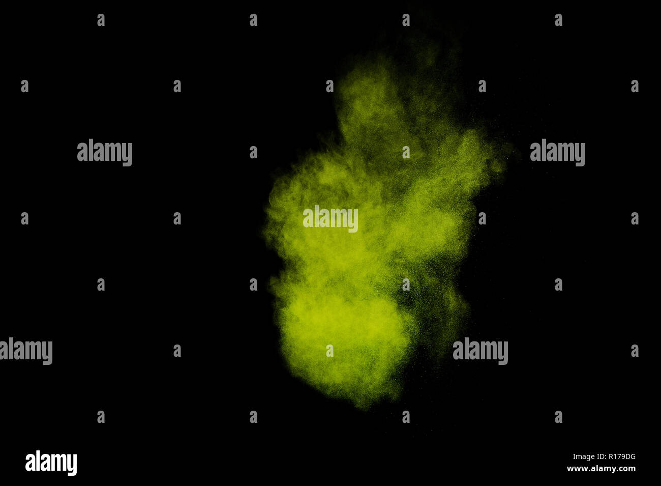 Light green powder explosion on black background. Colored powder cloud. Colorful dust explode