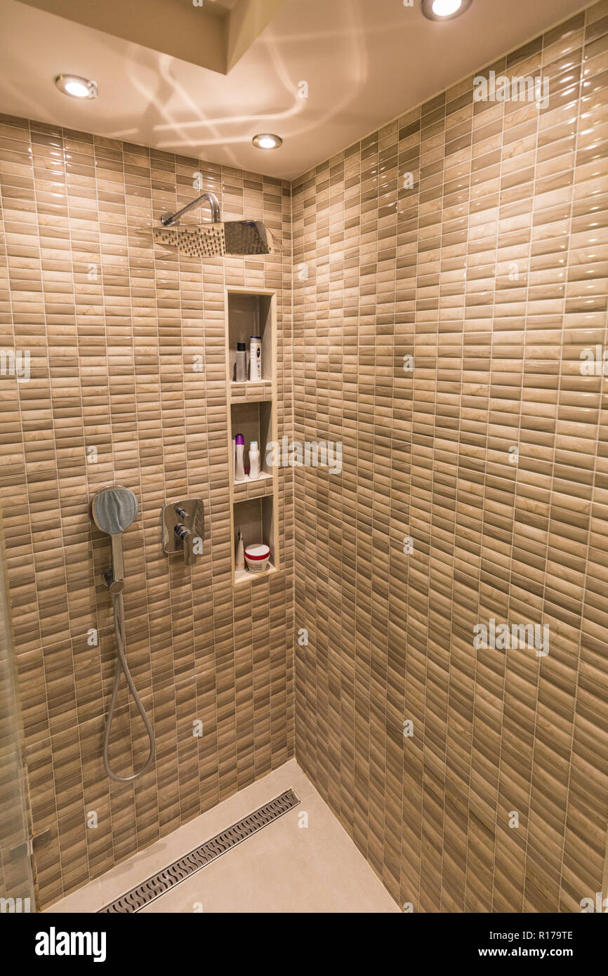 Modern shower and taps in bathroom Stock Photo