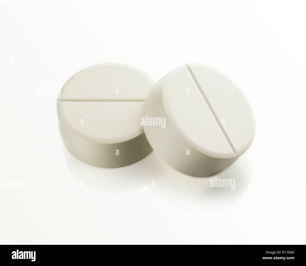 Two white medication pill tablets, still life Stock Photo