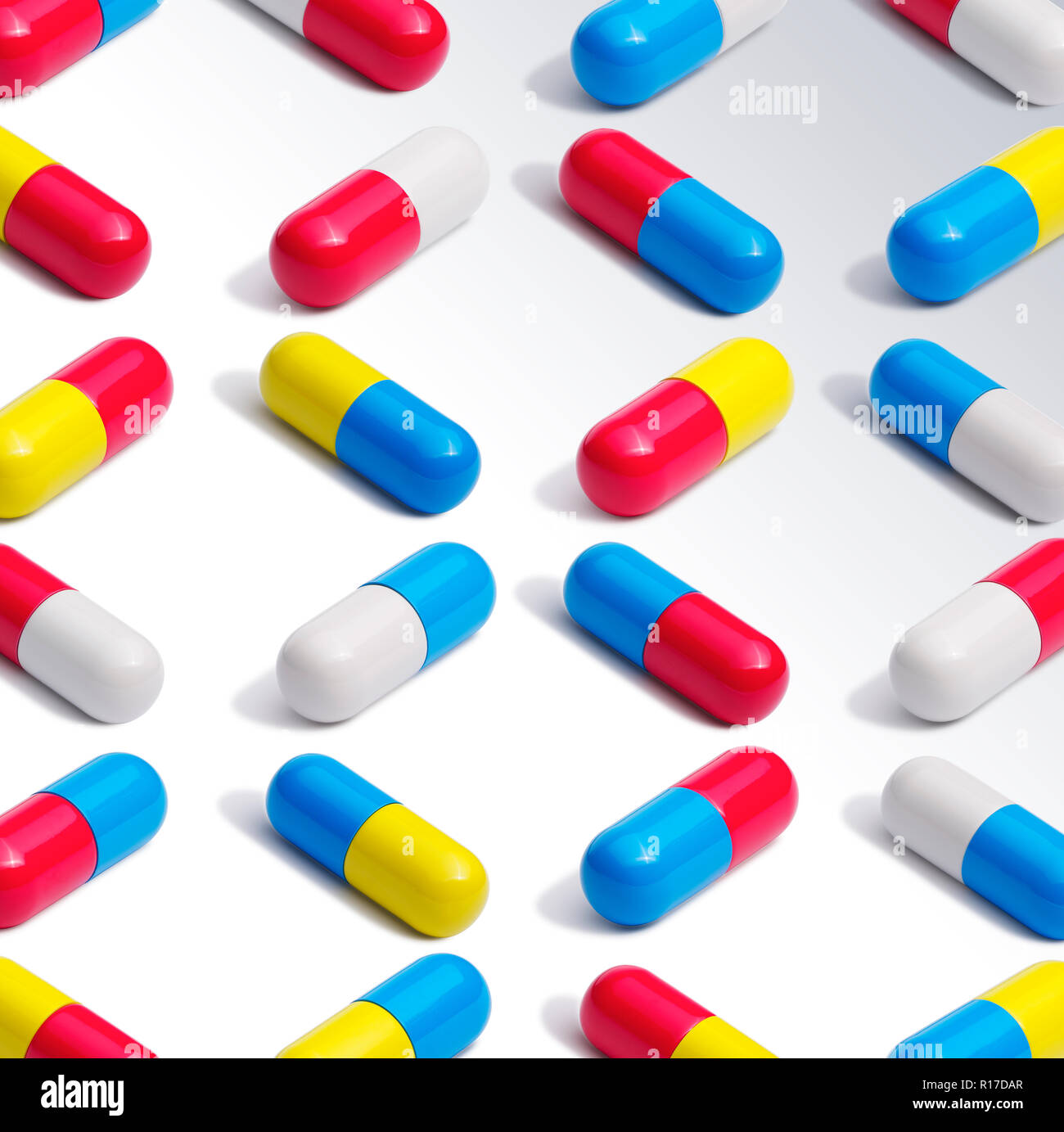 Medium group of colourful medication pill capsules in regular pattern, still life Stock Photo