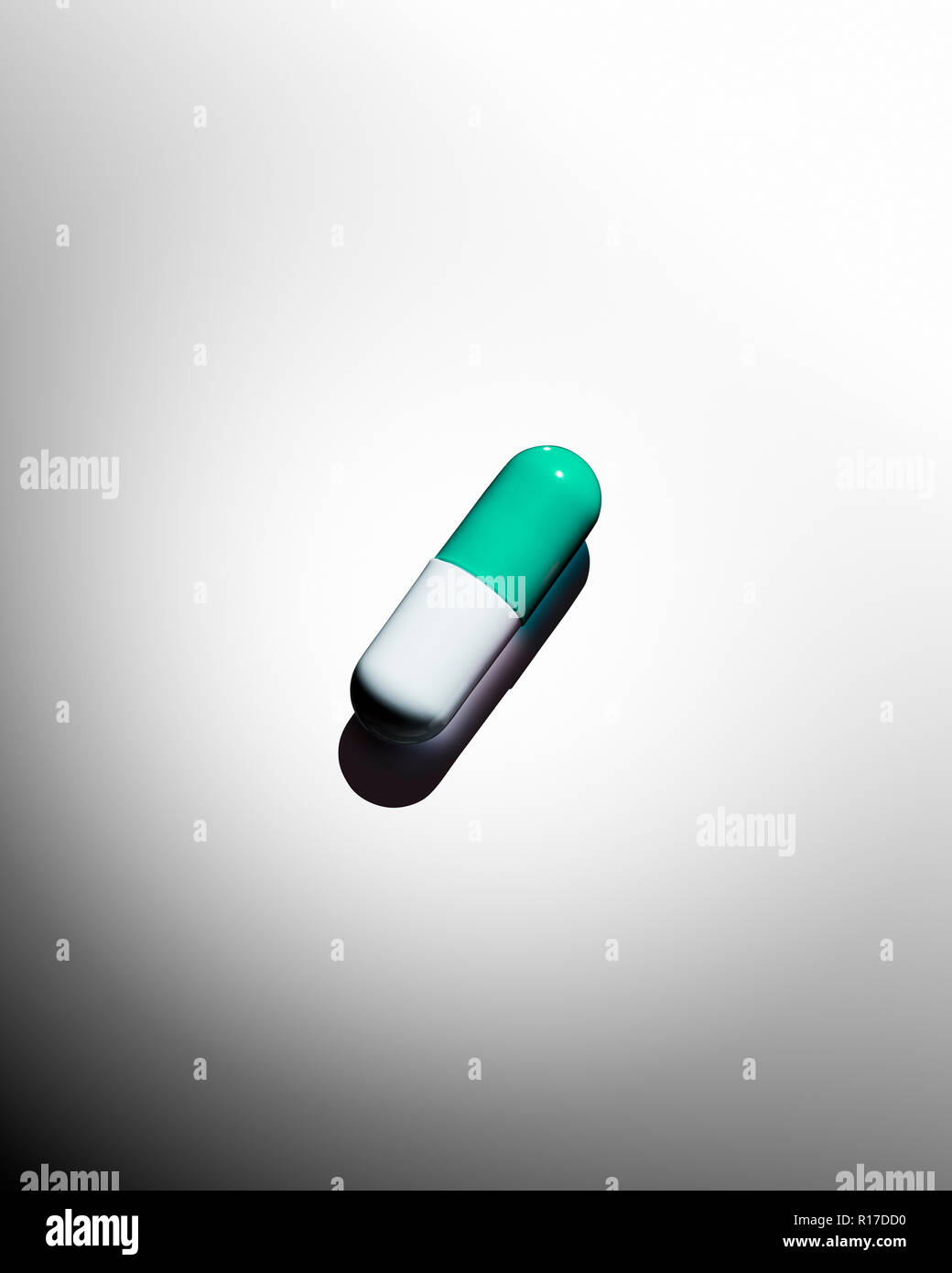 Green and white medication pill capsule, still life Stock Photo