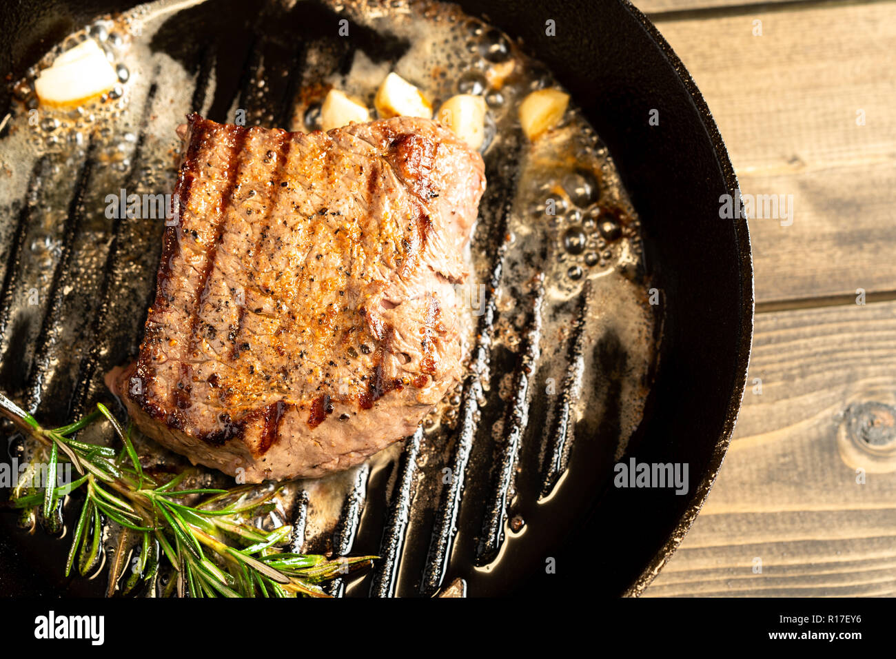 Overhead shot Steak in cast iron skillet Stock Photo