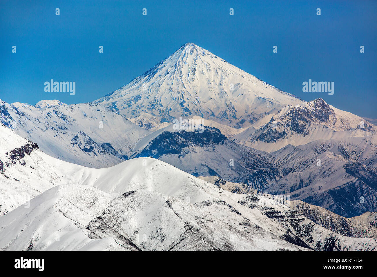 Mount Damavand, a potentially active volcano, is a stratovolcano which is the highest peak in Iran and the highest volcano in Asia. Stock Photo