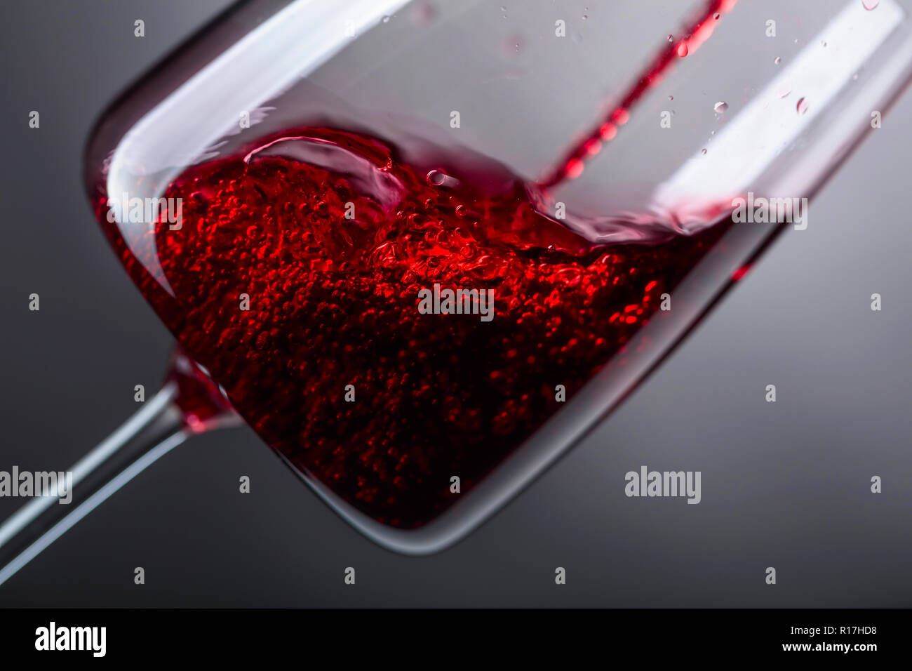 Red wine being poured into wine glass Stock Photo Alamy