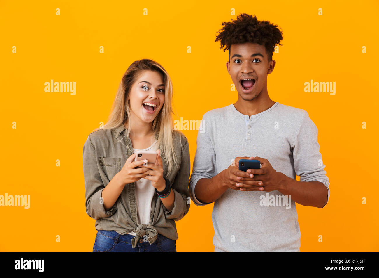 Image Of Happy Cute Young Loving Couple Posing Isolated Over Yellow