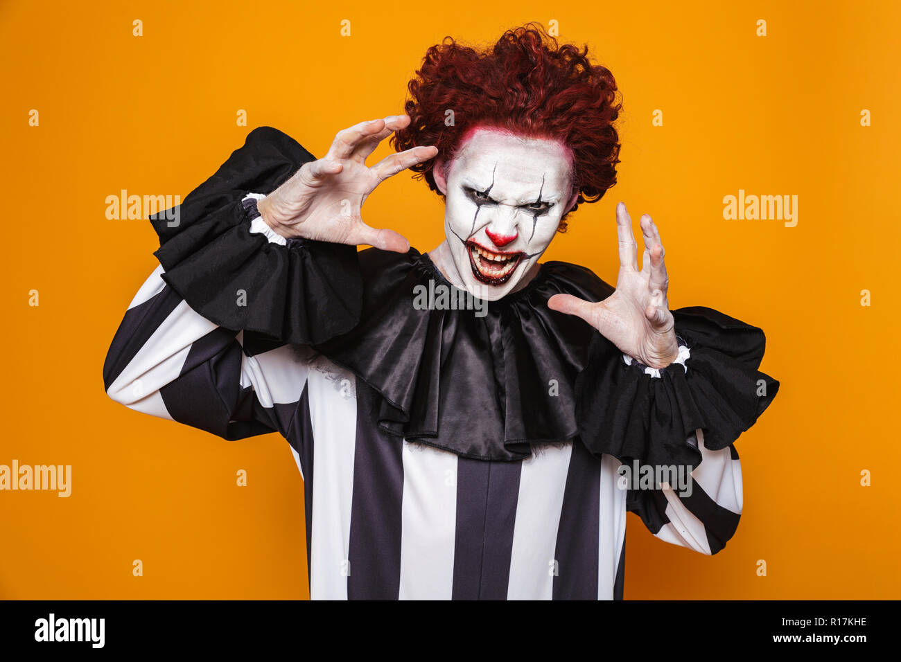 Scary Angry Man Clown With Red Hair Scream And Looking To Camera