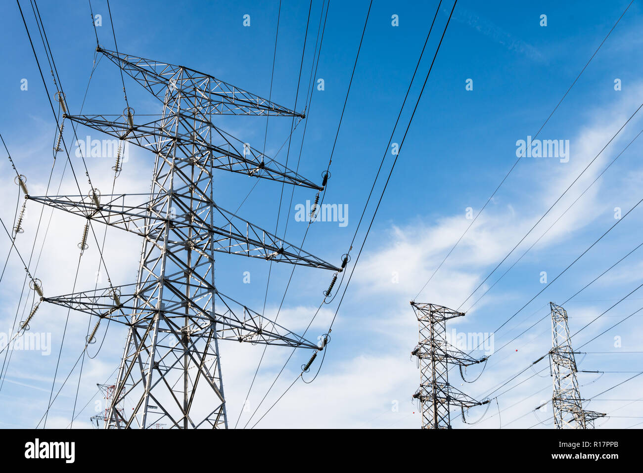 Overhead power lines and transmission towers. Stock Photo