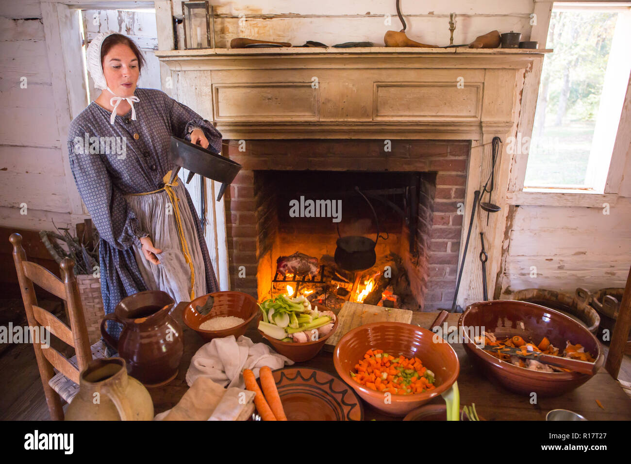 MCCONNELLS, SC (USA) - November 3, 2018:  A reenactor demonstrates cooking in the antebellum South during a recreation of the American Civil War. Stock Photo