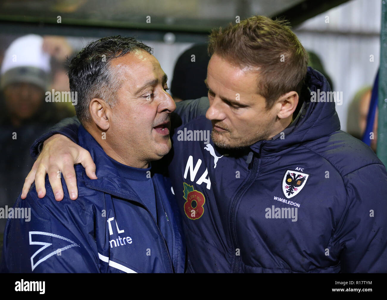Haringey Borough manager Tom Loizou and AFC Wimbledon manager Neal Ardley during the FA Cup first round match at the Coles Park Stadium, London. Stock Photo