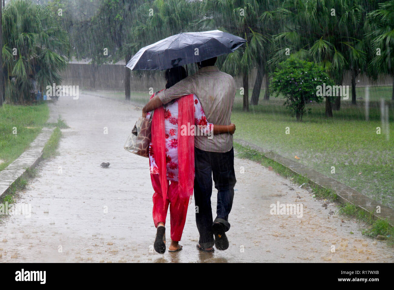 Loving couple in rain umbrella hires stock photography and images Alamy