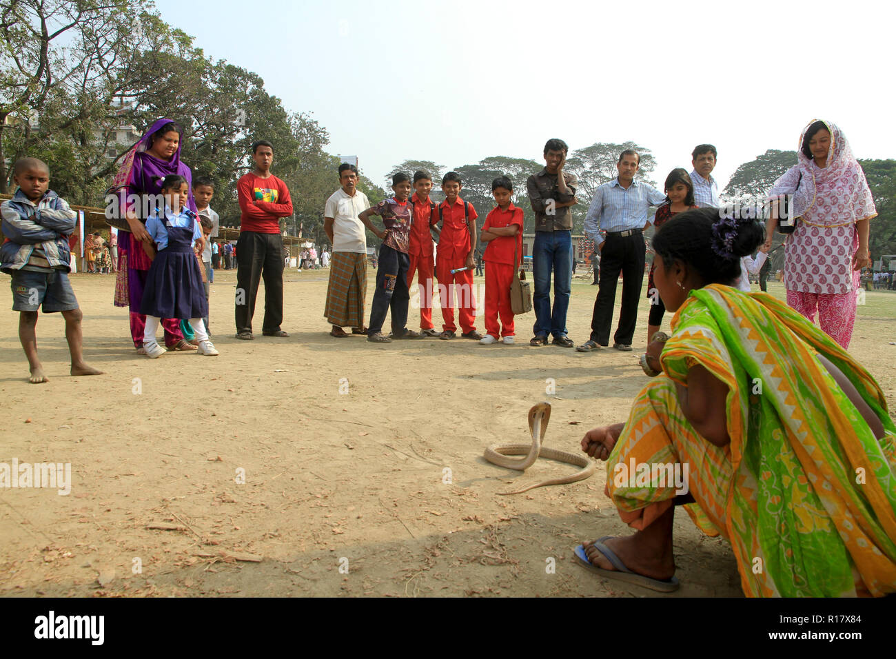 Snake charmer performs with snake. Dhaka, Bangladesh. Stock Photo