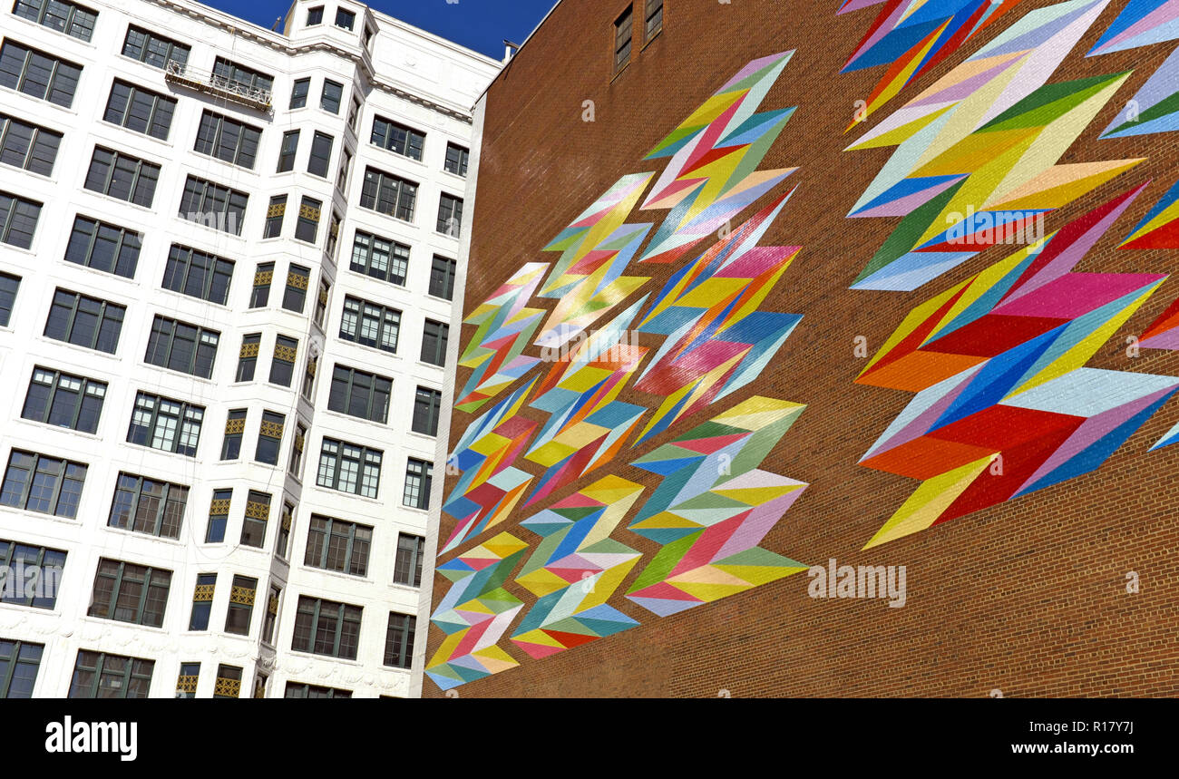 'Constellation' by Odili Donald Odita is painted on the side of the brick Halle Brothers parking garage across from the Halle Building in Cleveland. Stock Photo