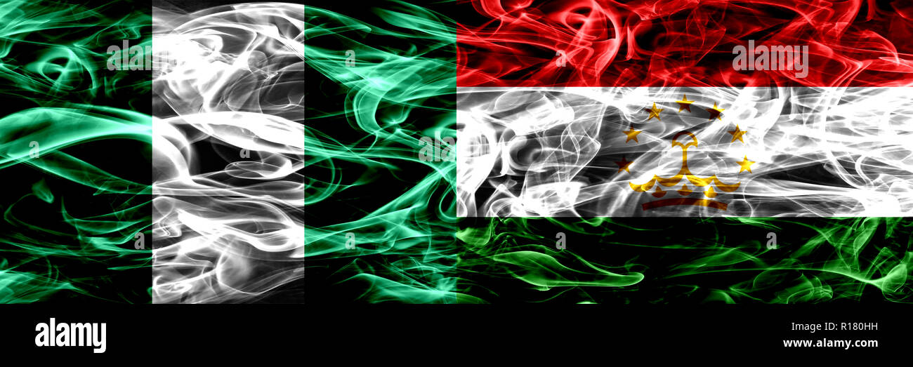 Nigeria, Nigerian vs Tajikistan, Tajikistani smoke flags placed side by side. Thick abstract colored silky smoke flags Stock Photo