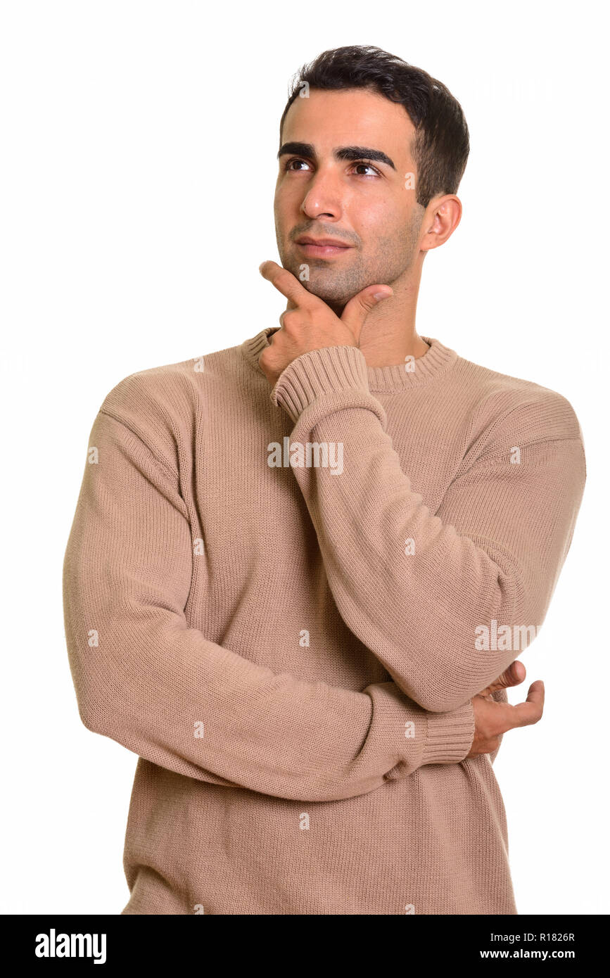 Portrait of young handsome Persian man planning and thinking Stock Photo