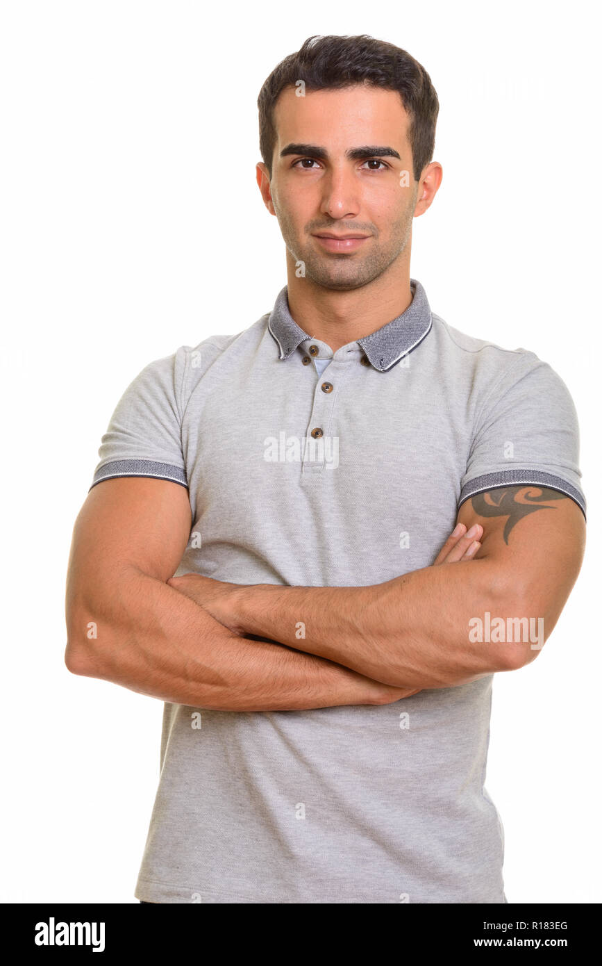 Portrait of young handsome Persian man against white background Stock