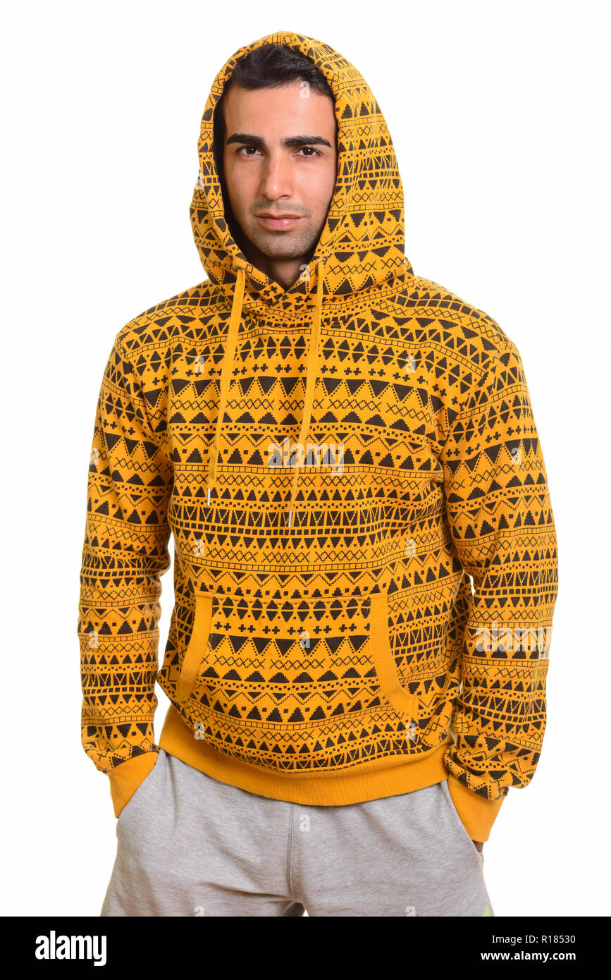 Portrait of young handsome Persian man wearing hoodie Stock Photo