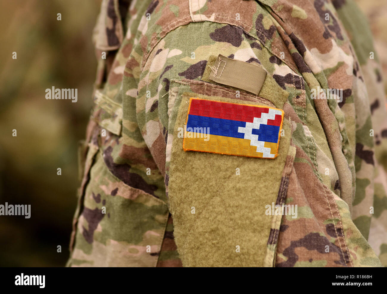 Republic of Artsakh flag on soldiers arm. Artsakh troops (collage) Stock Photo