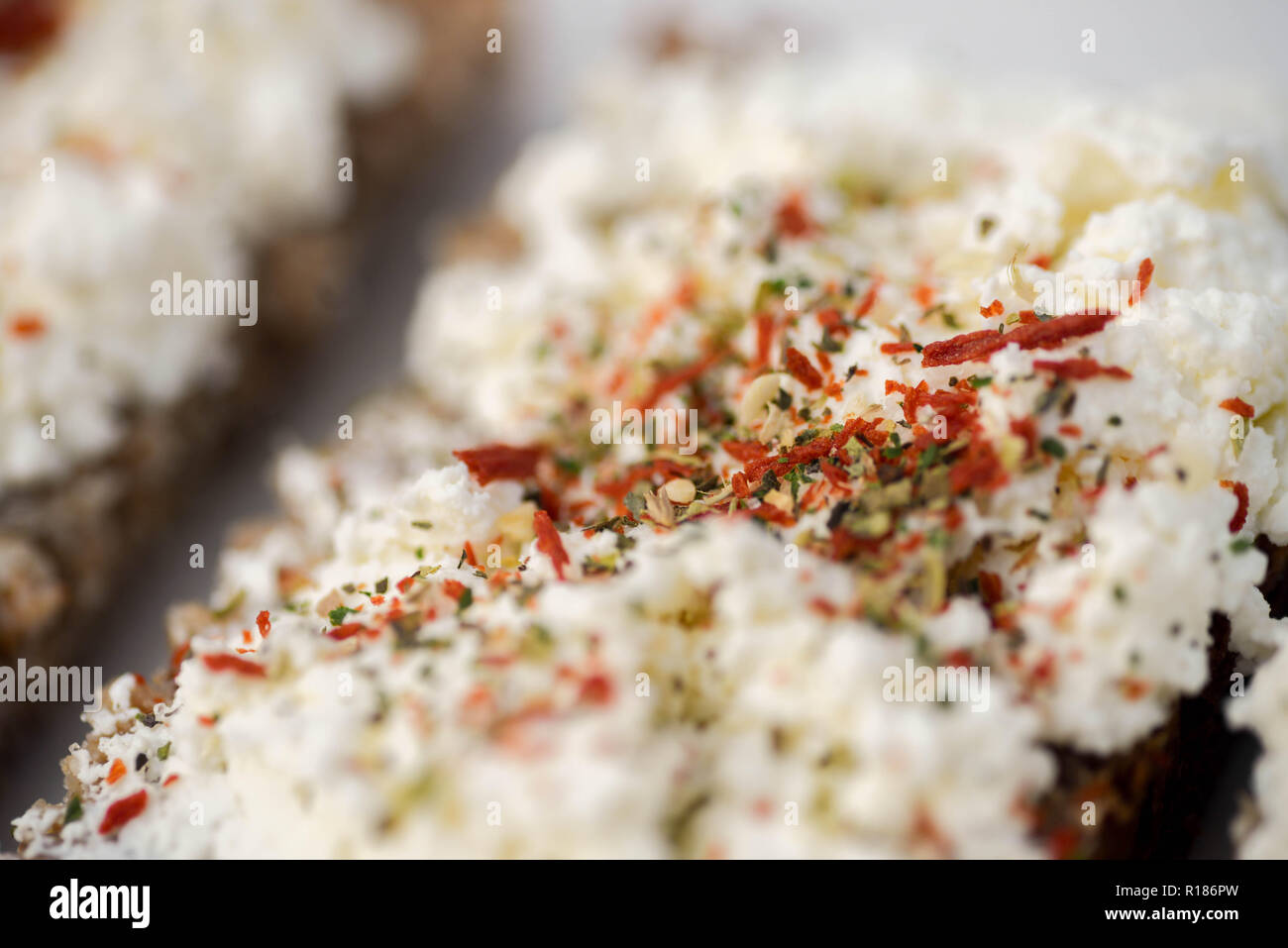 sandwiches with cottage cheese and herbs on plate Stock Photo