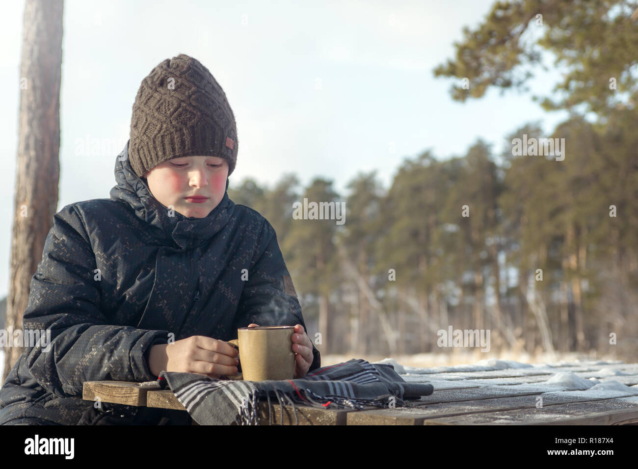 Boy In A Cold Winter Day Outdoors In Warm Clothes Stock Photo, Picture and  Royalty Free Image. Image 25442133.