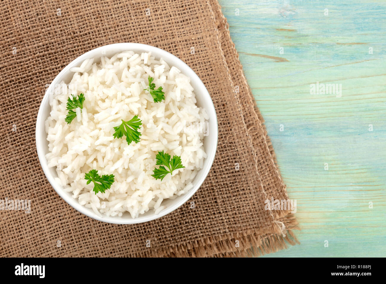 A photo of a bowl of cooked white long rice, shot from the top on ...