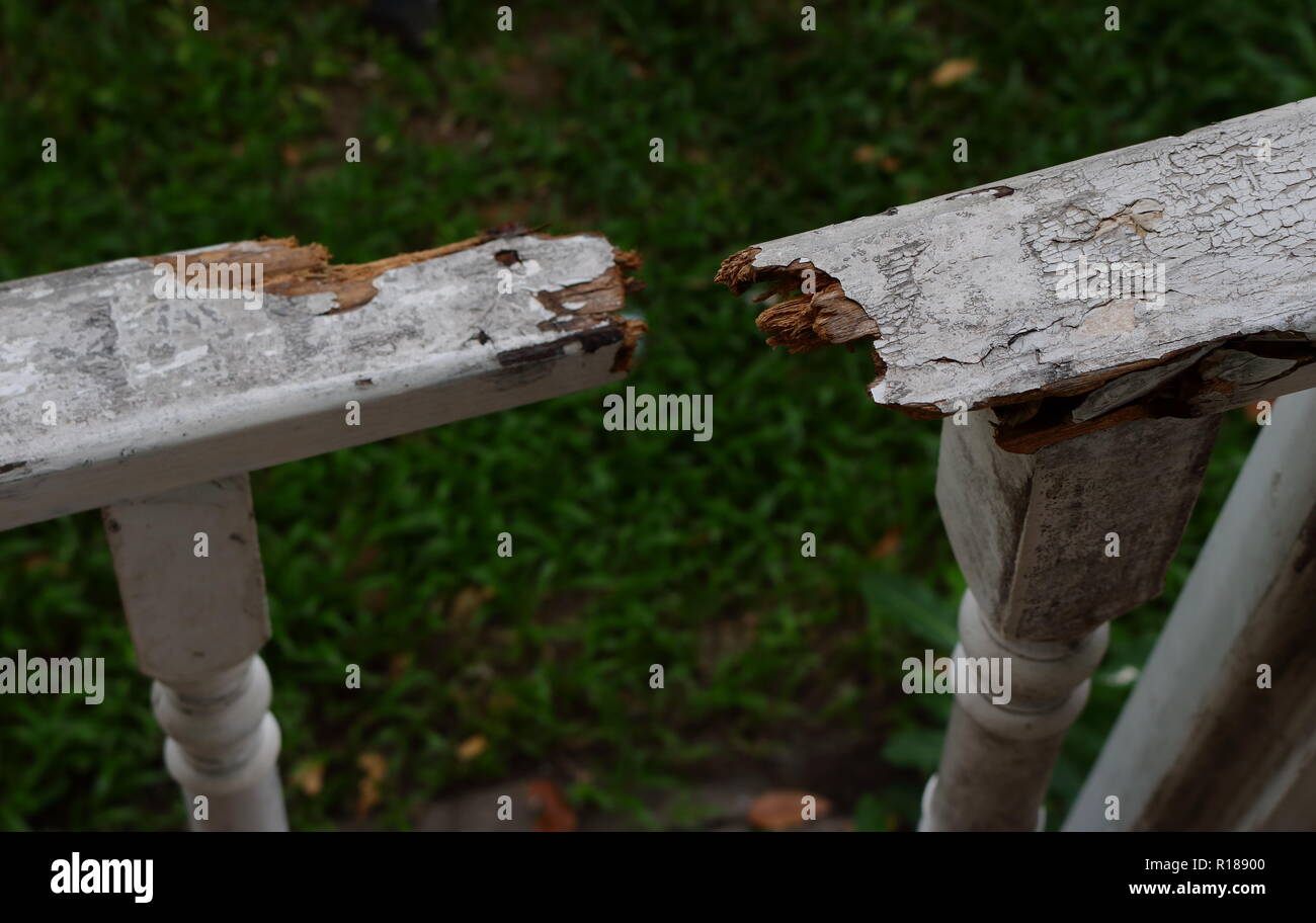 closeup image of broken wooden bar of a pavilion in garden, breaking ...
