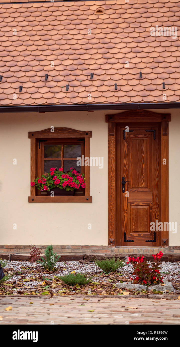 old house with windows and flowers, wooden doors, plants. background Stock  Photo - Alamy