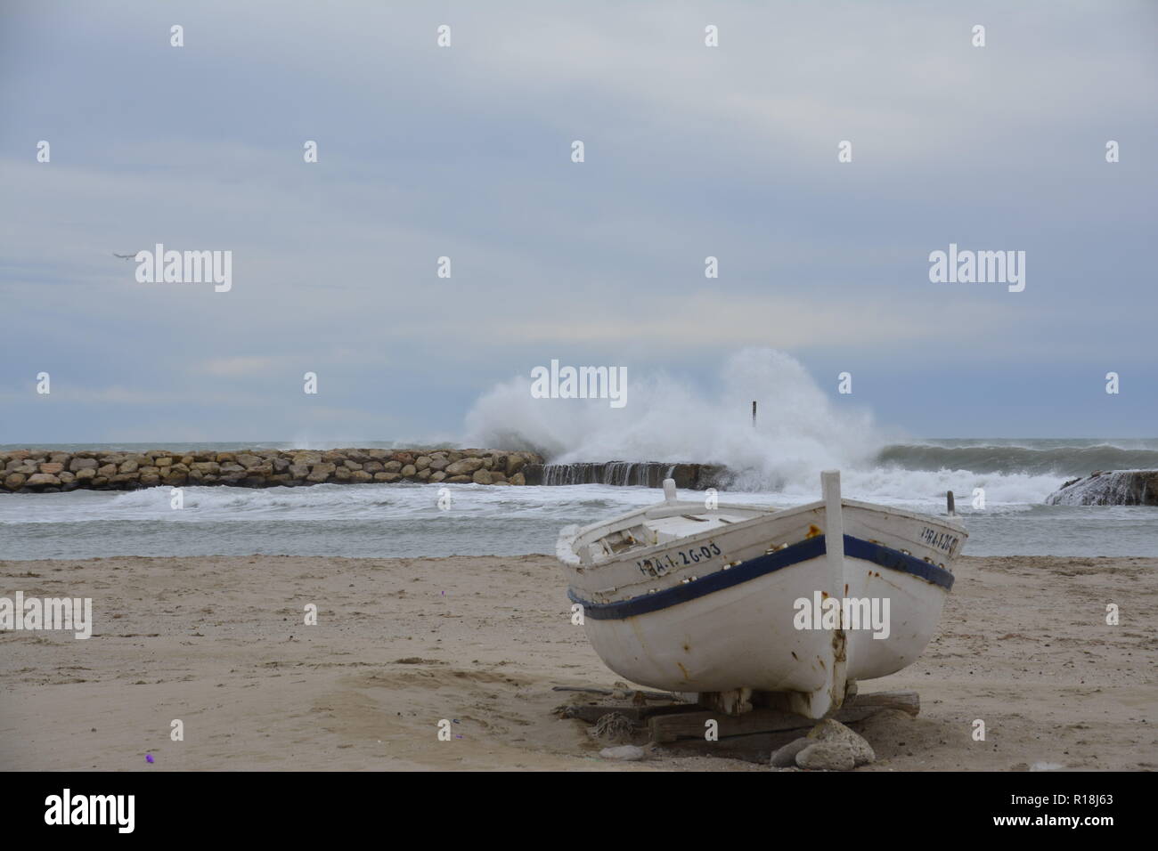 Unique old fisherman boat on the beach during winter period, relaxing ideal as desktop picture Stock Photo