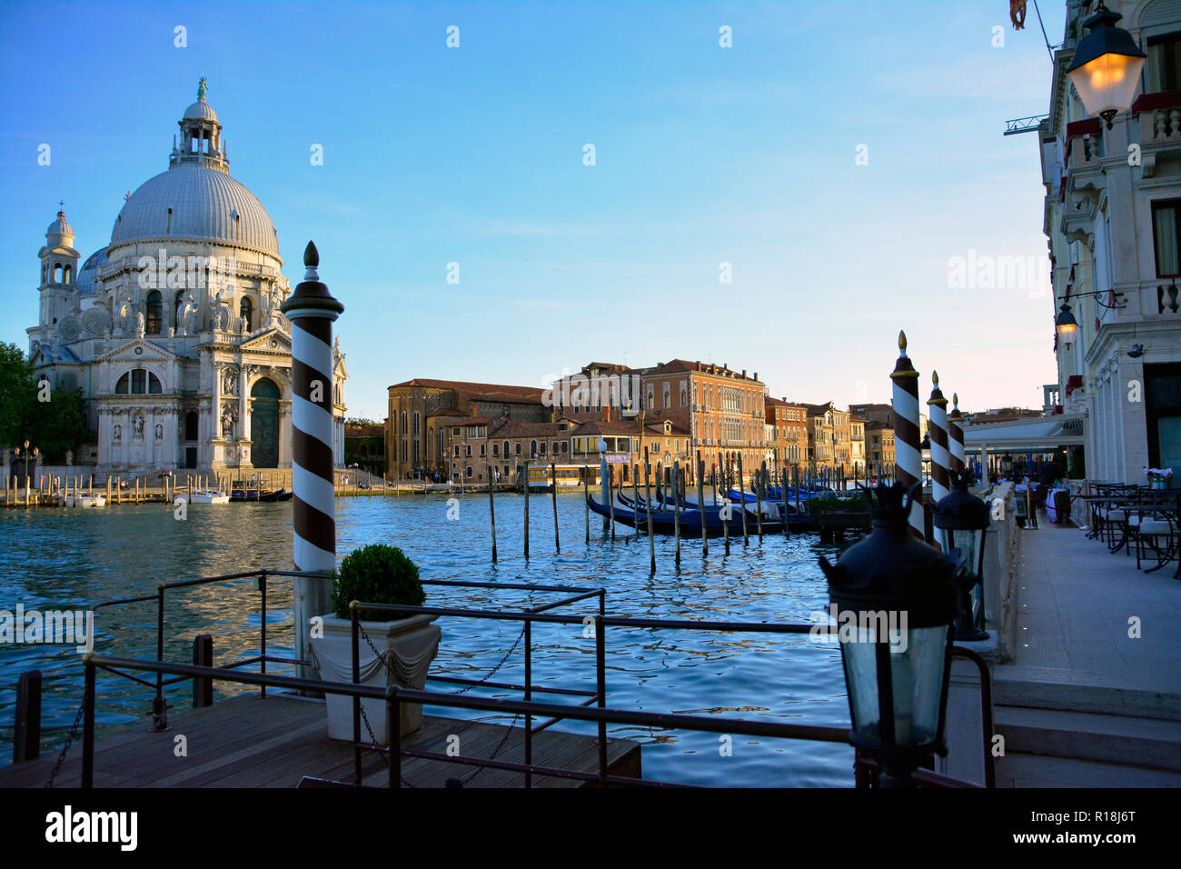 Venice Canal Grande view, overlooking Basilica Santa Maria della Salute, including Gondoles. Stock Photo
