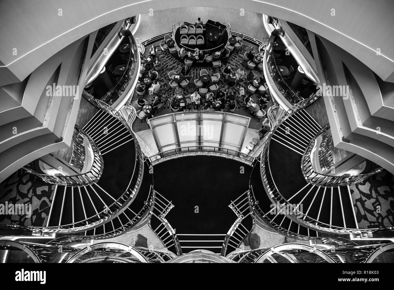 Mediterranean sea, Greece - 16.10.2018: Interior of The Atrium of Cruise Ship Norwegian Star with people during a cruise to Greece, black and white co Stock Photo