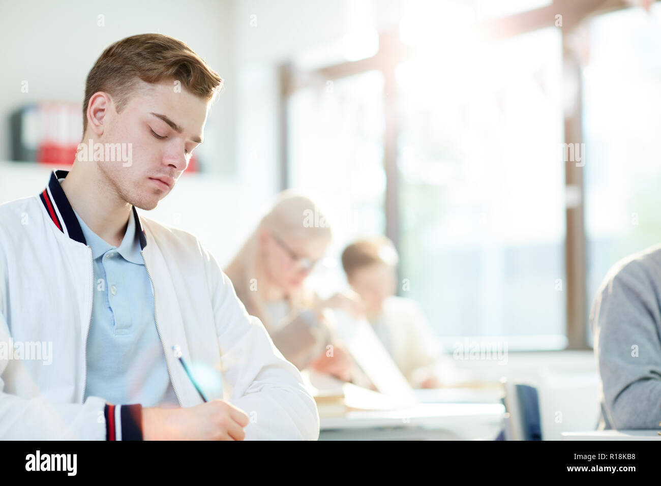 Teenage guy making notes hi-res stock photography and images - Alamy