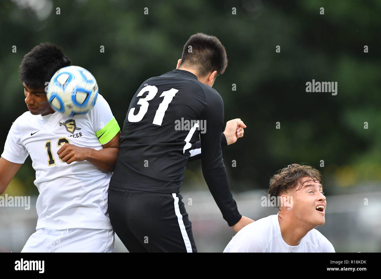 Players competing to execute a header. USA Stock Photo
