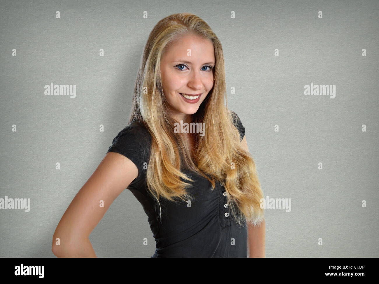 pretty young woman sympathetic blonde in jeans Stock Photo