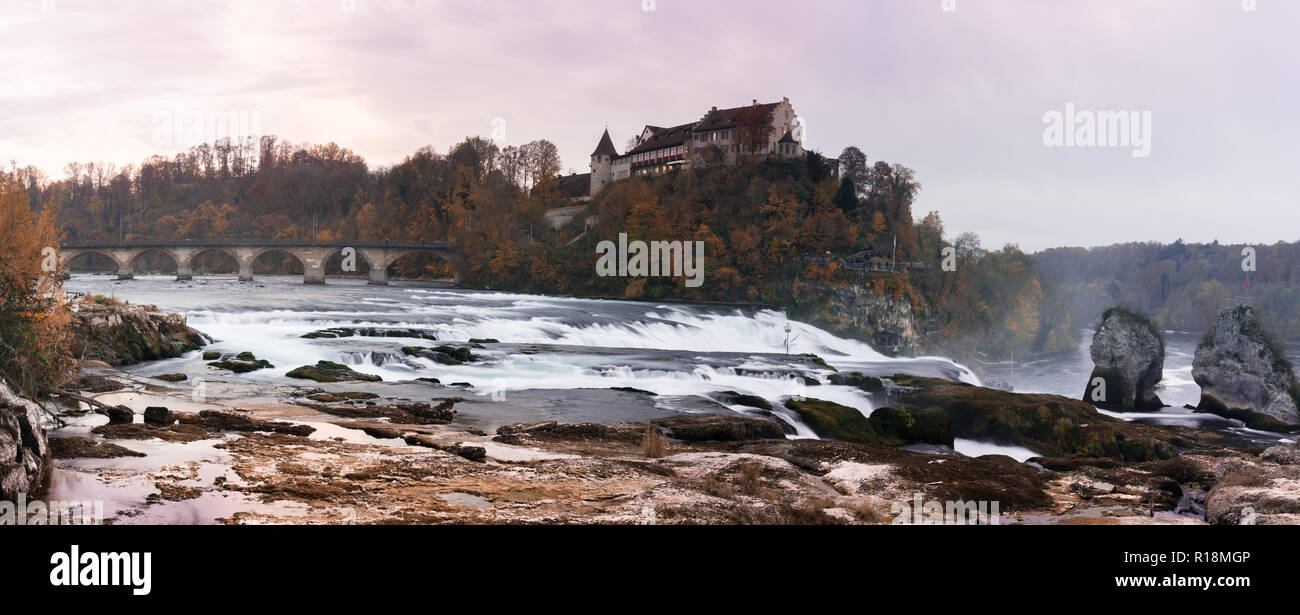 panorama view in the evening of the Rhine Falls in Schaffhausen in Switzerland with Laufen Castle in the background and historic low water levels Stock Photo