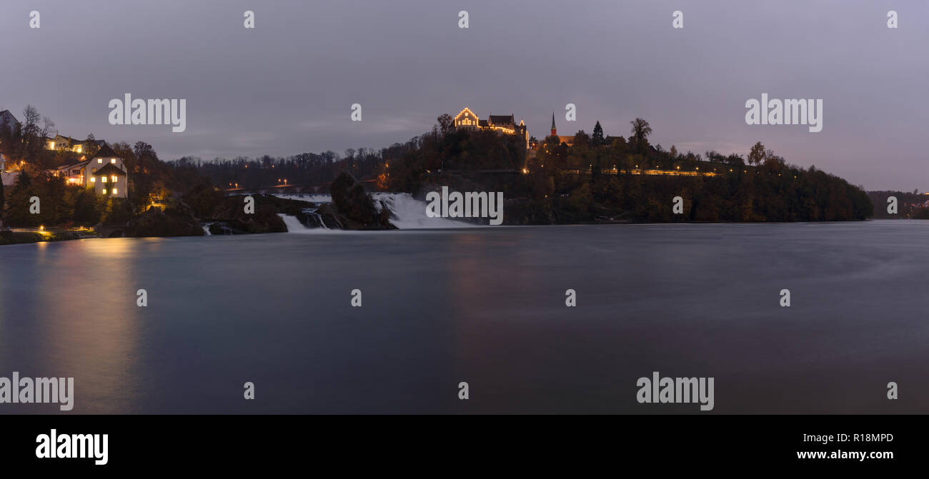 panorama view in the evening of the Rhine Falls in Schaffhausen in Switzerland with Laufen Castle in the background and historic low water levels Stock Photo