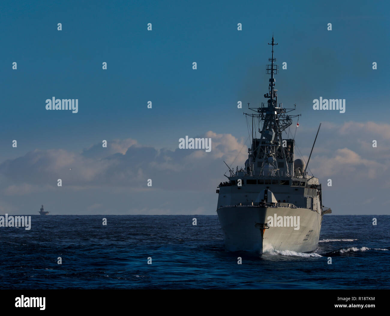 HMCS Halifax escorting aircraft carrier Stock Photo