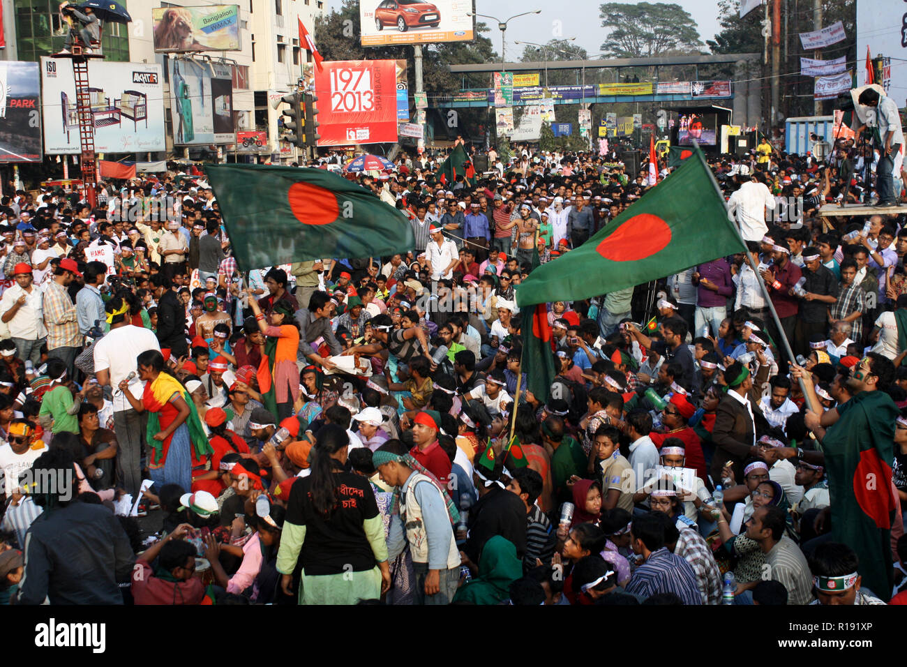 Bangladeshi peoples participate in a demonstration demanding the death