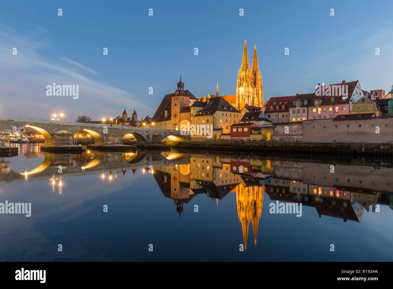 Evening view of the Stone Bridge, St. Peter's Church and the Old Town of Regensburg Stock Photo