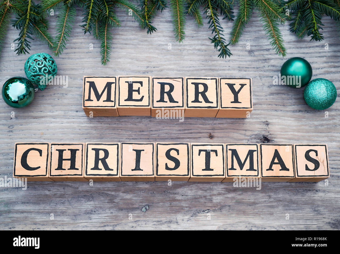 Wooden Cubes With Letters Form The English Text Merry Christmas They Are Lying On A Wood Background Fir Branches And Christmas Balls Are Next To It Stock Photo Alamy Wooden Cubes With Letters Form The English Text Merry Christmas They Are Lying On A Wood Background Fir Branches And Christmas Balls Are Next To It Stock Photo Alamy