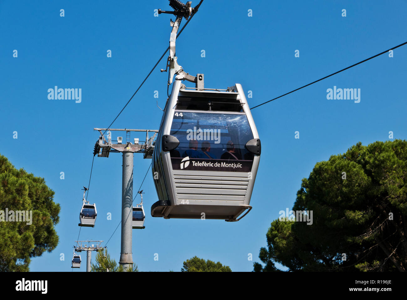 People travelling by the cable cars to the Montjuïc Castle, Barcelona ...