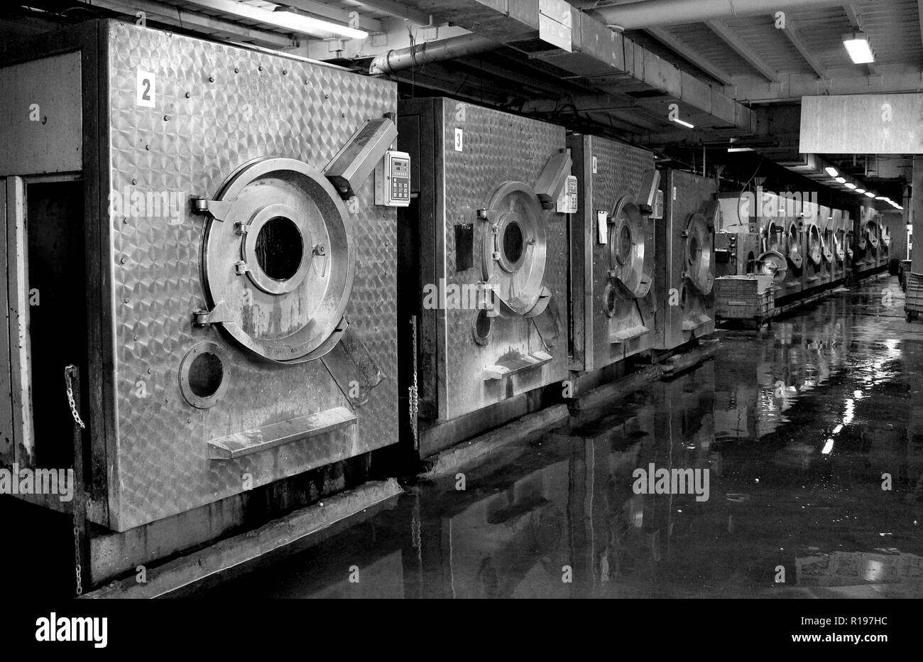 Black and white photograph of the old workshop washing and sandblasting jeans Stock Photo